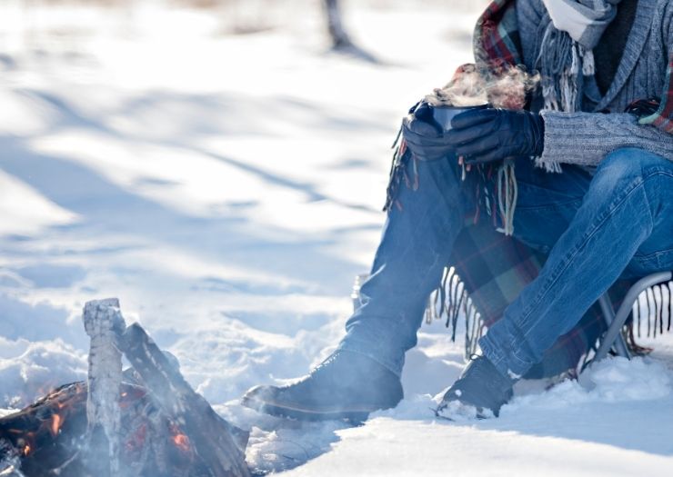 Camping in the winter by campfire