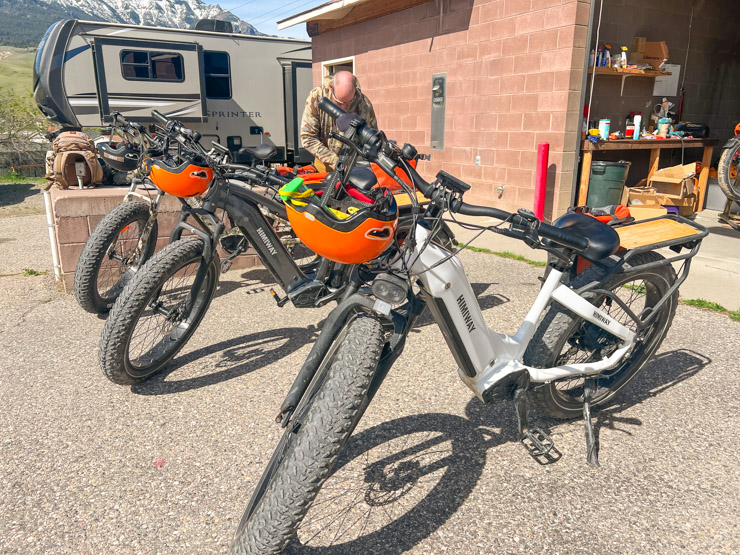 Photo of a man packing an e-bike with supplies. Big Sky E-Bike Tours and Rentals is the location.