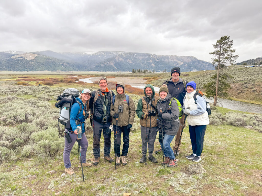 Group of people hiking in Lamar Valley .
Gardiner Montana to Yellowstone National Park.