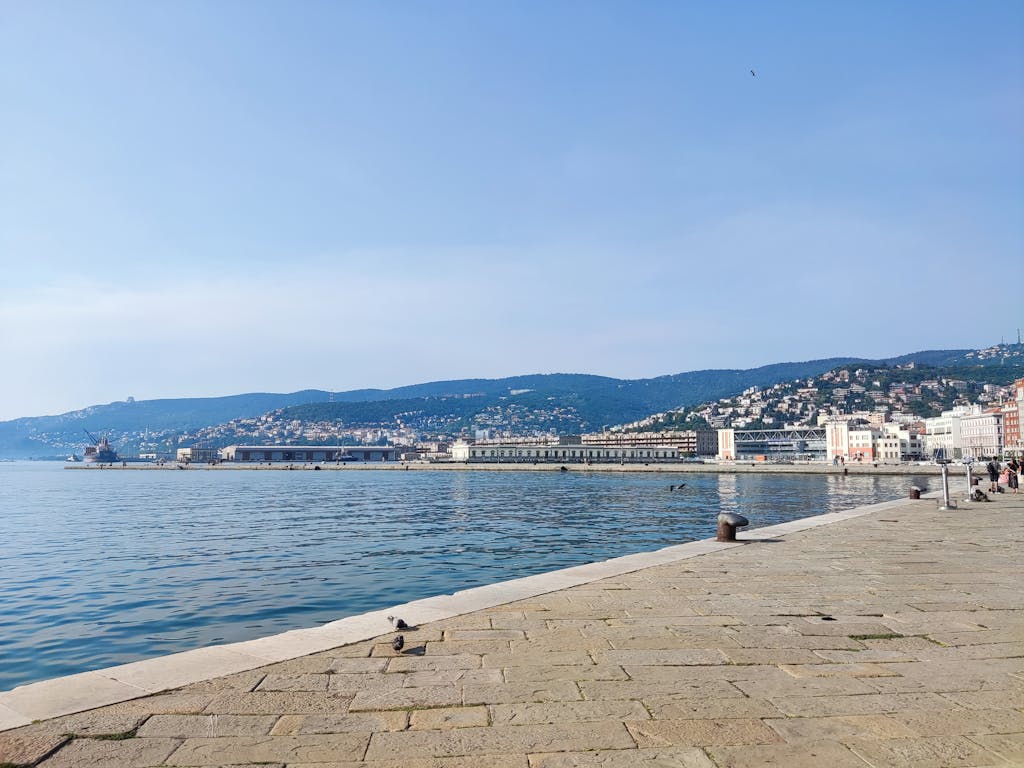 Beautiful view of the harbor and coastline in Trieste, Italy, with clear sky. Venice cruise port Trieste