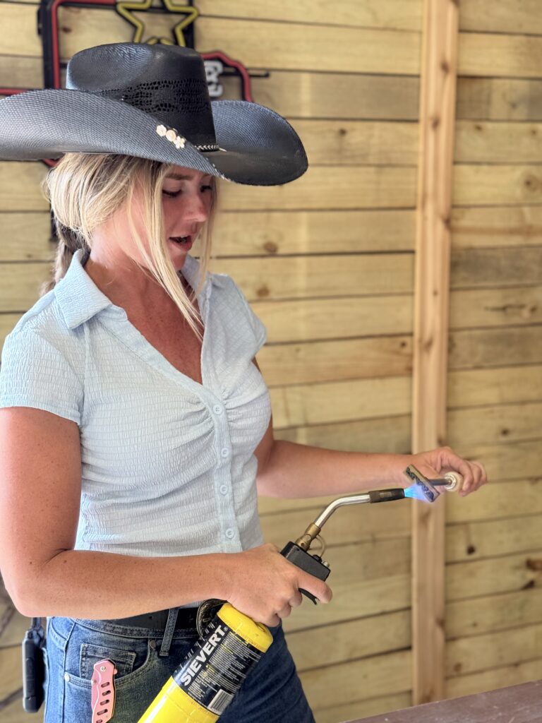 Being shown how to brand luggage tags