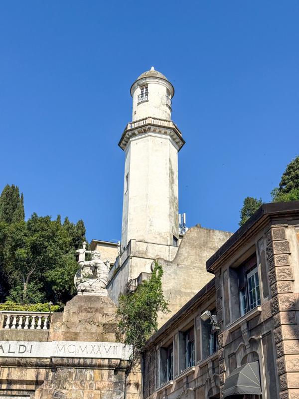 The tower belongs to Palazzo Nicolosio Lomellino in Genoa, Italy. It is a historic 16th-century palace on Via Garibaldi and is part of the famous Rolli Palaces. The tower, sometimes called the “Minaret” or “Mirador,” has a unique design and was later expanded in the 18th century.