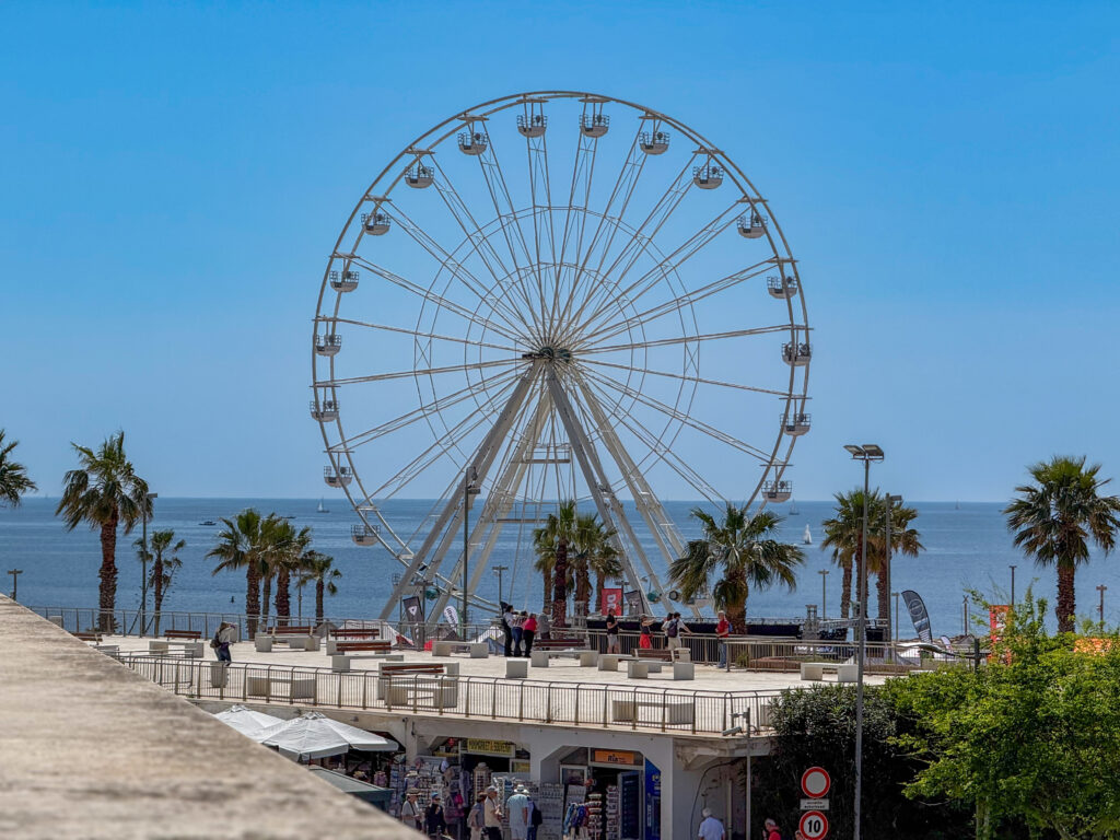 Ferris wheel positioned directly by the Mediterranean Sea in Citivecchia  near Civitavecchia Cruise Port
