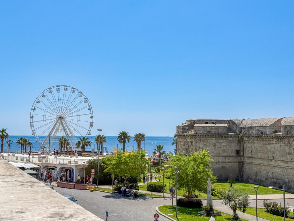 Ferris wheel positioned directly by the Mediterranean Sea near Civitavecchia Cruise Port