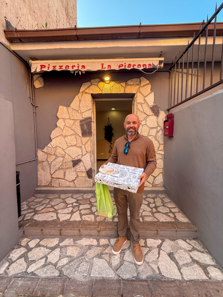 Daniel getting dinner at Pizzeria La Pierona near Civitavecchia Cruise Port