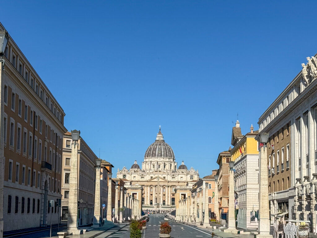 view looking down the Via della Conciliazione towards St. Peter's Basilica in Vatican City, Rome, Italy.
