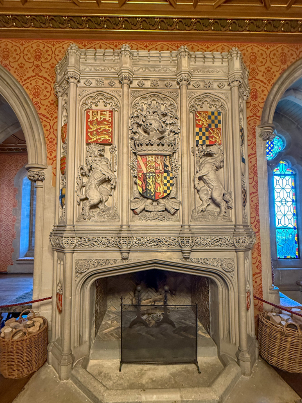 Ornate chimney-piece is located in the library 