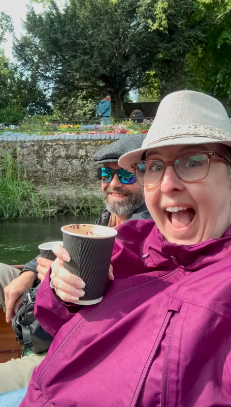 Melissa and Daniel with drinks on teh boat