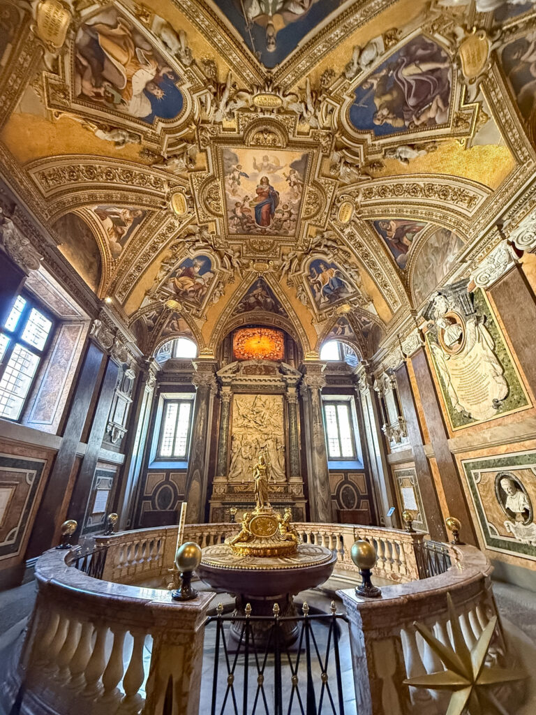 This image depicts the interior of the Baptistery within the Basilica of Santa Maria Maggiore in Rome, Italy