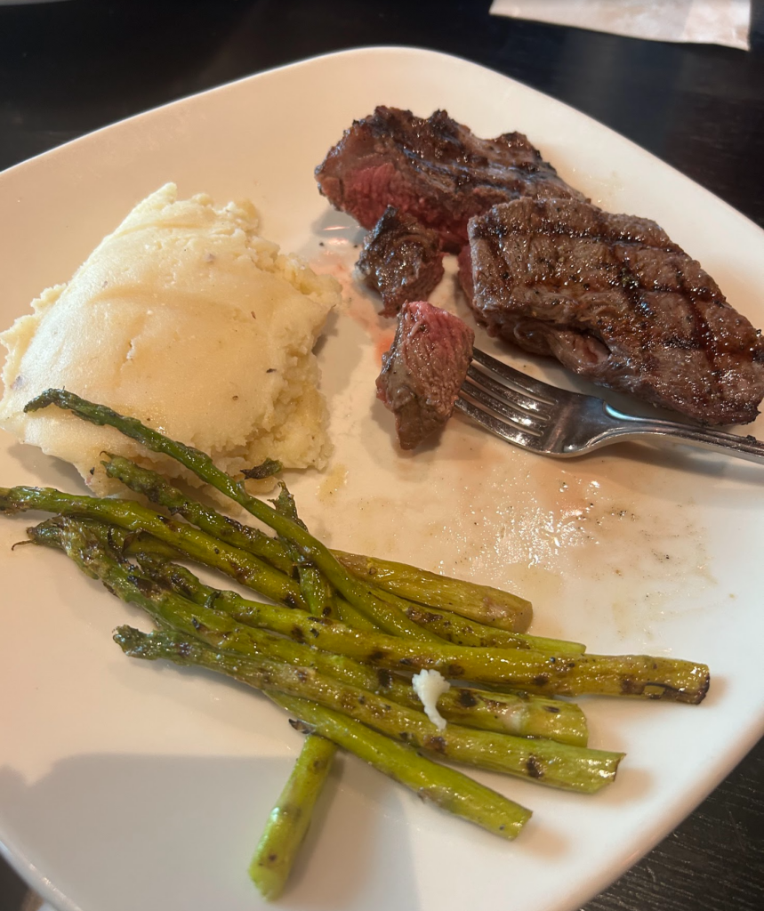 Steak, potatoes and asparagus at Springs During our Getaway & Retreat in Sulphur